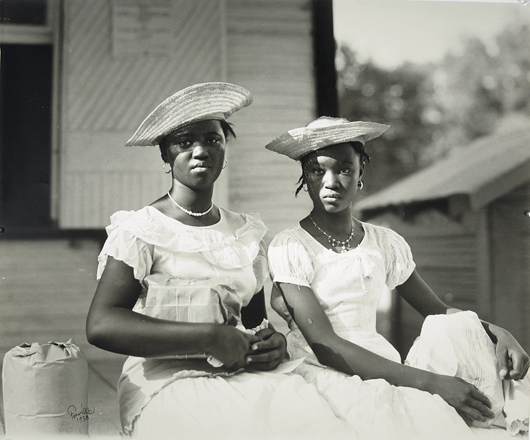 Louisiana photographer Fonville Winans (1911-1992) captured intuitive glimpses of local people and manners. This silver gelatin print of two ‘Dixie Belles,’ signed and dated 1938, brought $12,200. Image courtesy Neal Auction Co.