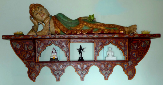 This wall shelf with a reclining Buddha reflects Burstyn's penchant for decorative whimsy. Image by Susan McTigue.