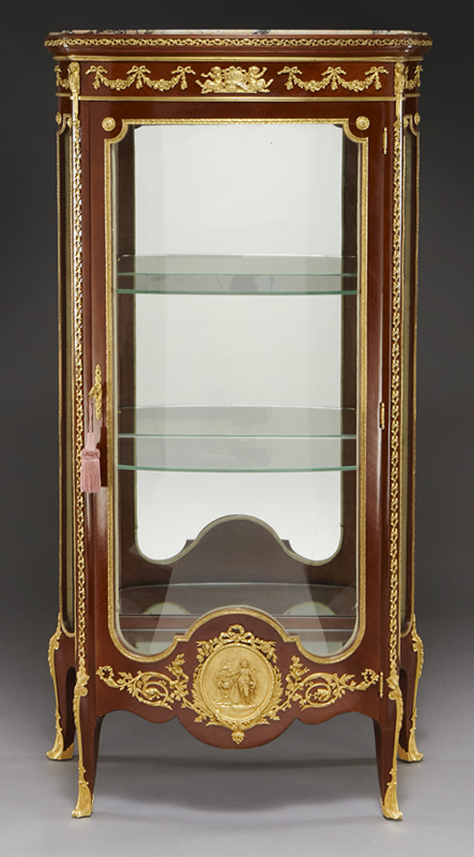 Linke mahogany Louis XV-style vitrine. Curved glass in door and side panels. Signed on bronze mount, ‘F. Linke.’ Francois Linke (French, 1855-1946). Estimate: $20,000-$30,000. Image courtesy Dallas Auction Gallery.