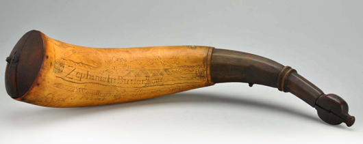 14-inch-long powder horn dated ‘1768,’ inscribed with fish and the name “Zephaniah Butler, $21,600. Morphy Auctions image.