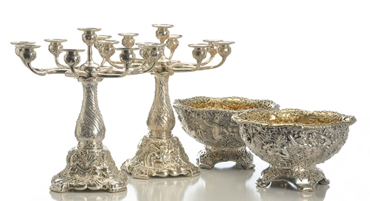 From a superb selection of extensively chased and embossed Tiffany & Co. silver, a pair of circa-1882 nine-light candelabra with triton, seahorse and mermaid motif, $111,600; and a pair of circa-1882 center bowls, $134,400. Morphy Auctions image.
