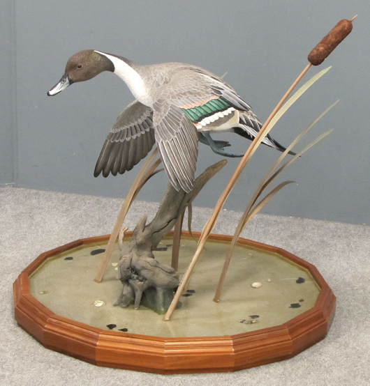 Ward E. Hermann (American NY 1936-2009) hand-carved and painted mallard duck in flight. Image courtesy William Jenack Estate Appraisers and Auctioneers.