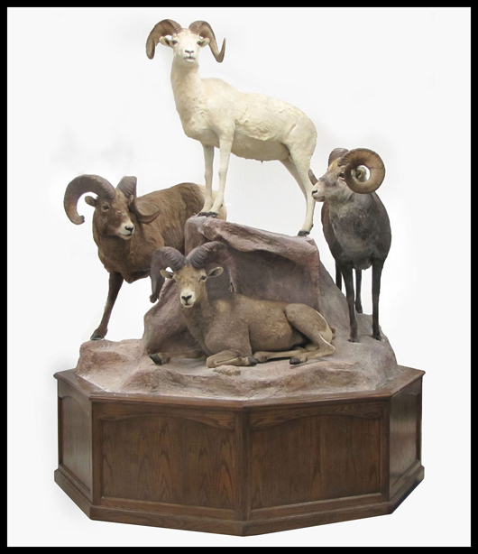 Rare 'Grand Slam' full-body mounted American bighorn sheep on mountain. Image courtesy William Jenack Estate Appraisers and Auctioneers.
