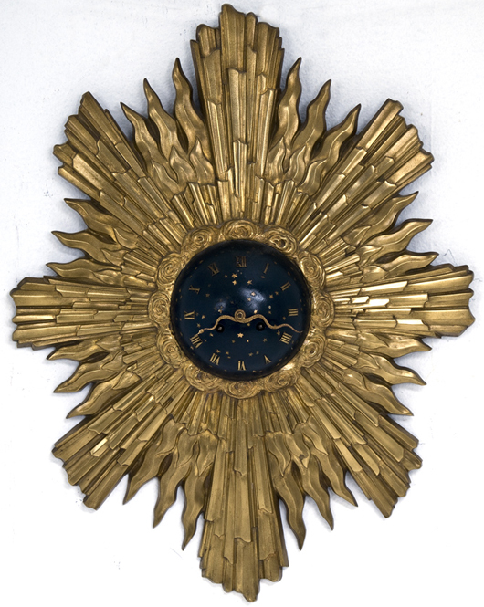 French bronze and enameled sunburst clock in the Louis XV style with celestial orb face with emanating ray back, 26 inches high. Image courtesy A.N. Abell Auction Co. 