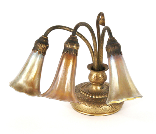 Tiffany bronze and Favrile glass three-light Lily lamp. Estimate: $3,000-$5,000. Image courtesy Gray’s Auctioneers.
