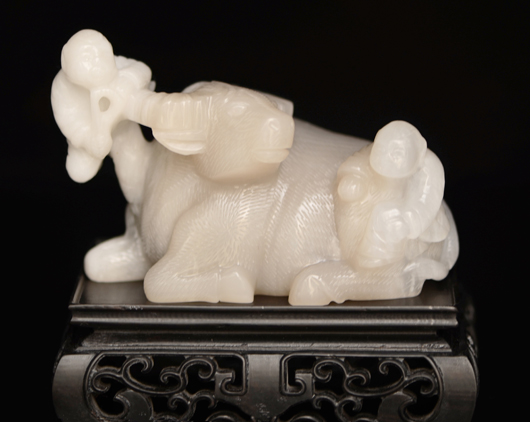 Finely carved pale lavender jadeite water buffalo with children at play. Image courtesy Gianguan Auctions.