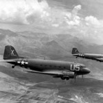 Two USAAF C-47A Skytains loaded with paratroopers on their way for the invasion of southern France on Aug. 15, 1944. Image courtesy Wikimedia Commons.
