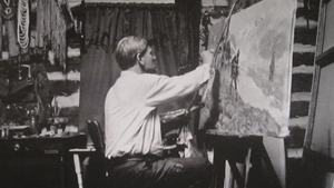 A 1914 poster depicts Charles M. Russell painting in his studio in Great Falls, Mont. Image courtesy Wikimedia Commons.