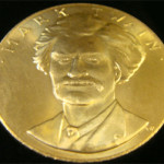 Mark Twain commemorative gold coin issued by the U.S. Mint, still housed in the original box. Image courtesy of Tim's, Inc.
