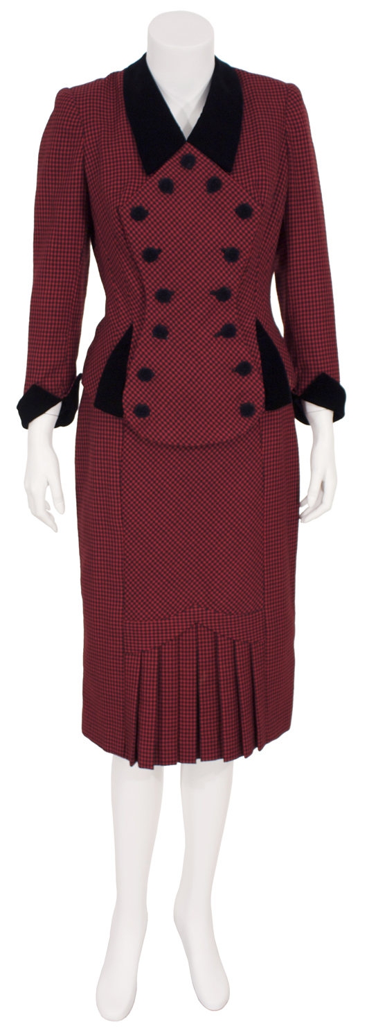 1940s red and black mini-check suit worn by Madonna in her portrayal of Eva Peron in the 1996 motion picture 'Evita.' Premiere Props image.