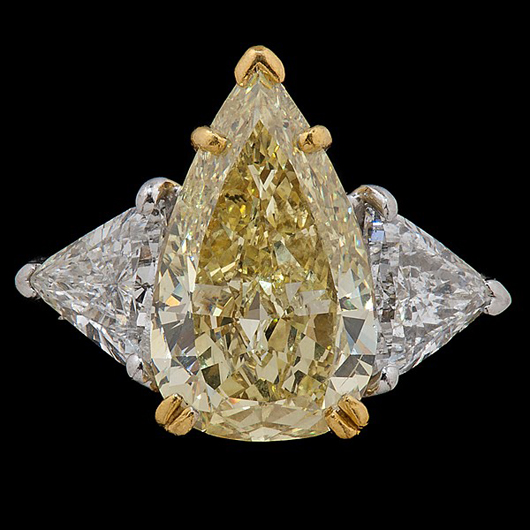Highlighted in the sale is a beautifully made ring containing a platinum setting with a 22-karat yellow gold basket head that features one natural fancy yellow pear-shaped cut diamond. This diamond, approximately 5.05 carats, is flanked by two trillion-cut diamonds and is estimated to bring $50,000-$70,000. Image courtesy Cowan’s Auctions Inc.