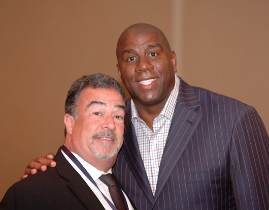 Earvin 'Magic' Johnson (right), at Grey Flannel Auctions' 2009 Basketball Hall of Fame pre-induction dinner with Grey Flannel's president, Richard E. Russek. Copyrighted image courtesy of the photographer, Chuck Miller.