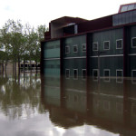 The University of Iowa's Art Building West (foreground) and Art Building (background) during the Iowa Flood of 2008. Image by Craig Dietrich. This file is licensed under the Creative Commons Attribution 3.0 Unported license.