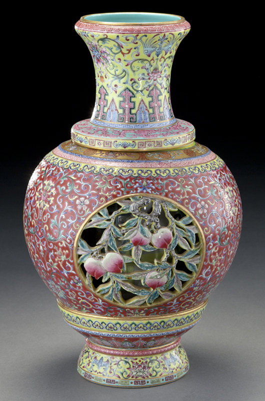 This 12-inch-tall Chinese Republic revolving and reticulated porcelain vase within a vase had openwork finely painted to depict peaches and scrolling lotus. It sold for $55,000 plus the buyer’s premium. Image courtesy Dallas Auction  Gallery.