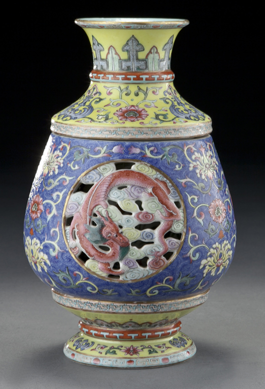 The smaller Chinese Republic revolving and reticulated porcelain vase within a vase, which had an interior depicting figures reading scrolls and playing games, hammered for $35,000. Image courtesy Dallas Auction Gallery.   