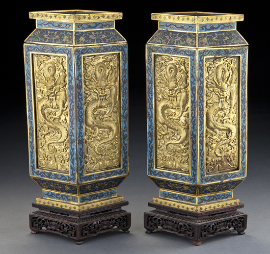 A pair of Chinese Qing Qianlong cloisonne vases depicting dragons and scrolling lotus, raised on original rosewood stands sold for $147,000. The estimate was $8,000-$12,000. Image courtesy Dallas Auction Gallery.