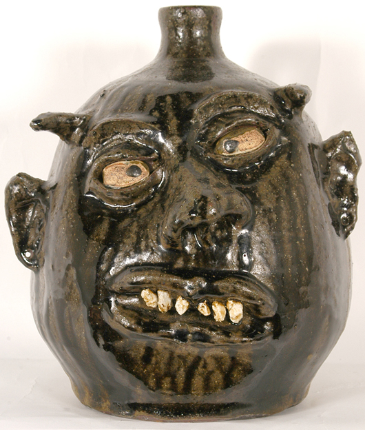 Devil rock tooth jug by the renowned craftsman Lanier Meaders, circa 1970s, in mint condition. Estimate: $2,000-$3,000. Image courtesy Slotin Auction.   