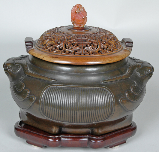 Chinese bronze censer with carved wood and carnelian mounted cover. Image courtesy of Mid-Atlantic Auctions.