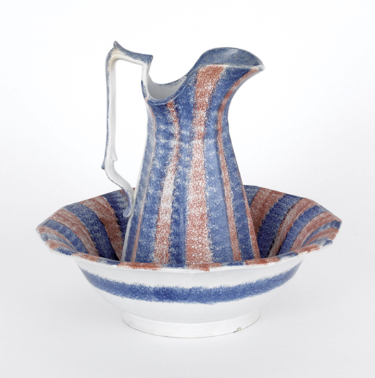This 12-inch pitcher with matching bowl circled by alternating blue and red spatter bands makes a bold statement on the shelf. The set brought $770 at Pook’s January sale. Courtesy of Pook & Pook