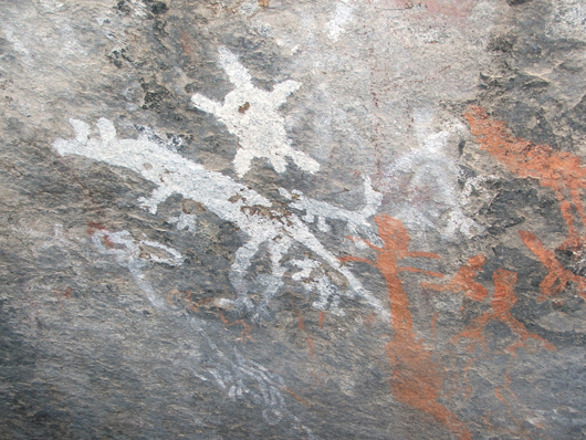 Aboriginal art in the 'Yankee Hat' shelter in Namadgi National Park, featuring a kangaroo, dingoes, echidna, turtles. Photo by Martyman of English language Wikipedia, licensed under the Creative Commons Attribution-Share Alike 3.0 Unported license.