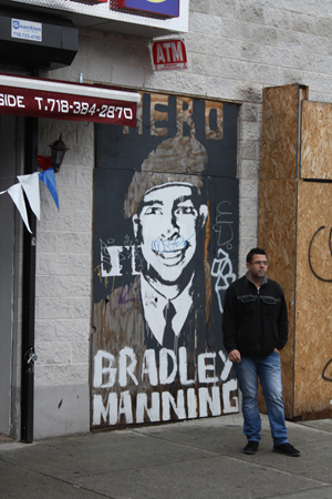 The Bradley Manning street art has received some graffiti of its own. Painting by Big Bamn. Photography by Kelsey Savage Hays.