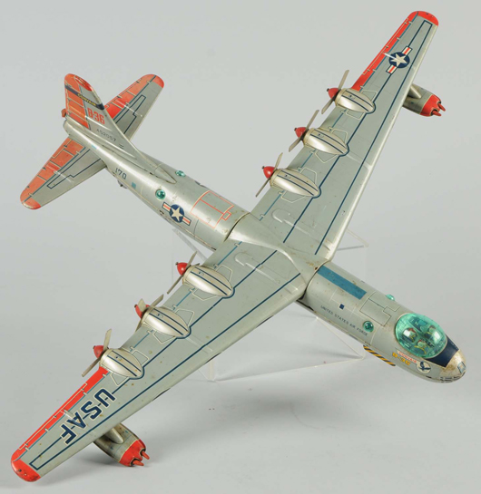 Yonezawa B-36 tin bomber with 26-inch (66 cm.) wingspan, est. $600-$900. Morphy Auctions image.