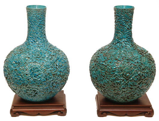 Pair of 18th century Chinese turquoise porcelain bottle vases with impressive relief floral design. Estimate: $10,000-$14,000. Image courtesy Elite Decorative Arts.