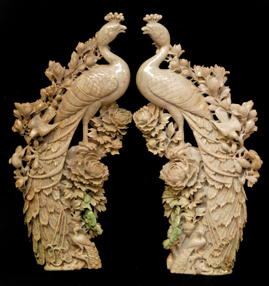 Pair of Chinese fully relief carved jadeite sculptures depicting phoenix birds perched on rocks. Estimate: $40,000-$60,000. Image courtesy Elite Decorative Arts. 