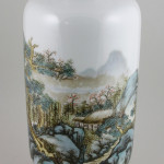 Chinese Republic Period Famille Rose vase, painted with a continuous landscape scene with calligraphy, mark on base, on wood stand, 15 inches x 6 1/2 inches. Sold For $220,000. Image courtesy Kaminski Auctions.