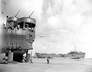 The LST-325 (left) and LST-388 stranded at low tide on the beach at Normandy, France on June 12, 1944. U.S. Navy photo, courtesy Wikimedia Commons.