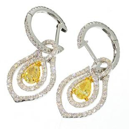 White and yellow gold earrings with 1.24 carats of diamonds. Valued at $5,300-$10,500. Government Auction image.