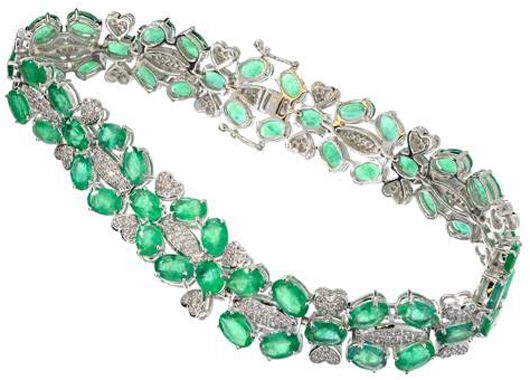 14K white gold bracelet featuring 19 carats of emeralds and 284 genuine round full diamonds with a total weight of 1 carat. Government Auction image.