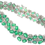 14K white gold bracelet featuring 19 carats of emeralds and 284 genuine round full diamonds with a total weight of 1 carat. Government Auction image.