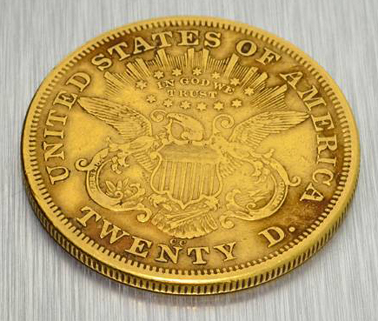 Reverse side of 1872 CC (Carson City) US$20 Liberty Head gold coin displaying the American Eagle and US Shield. Government Auction image.