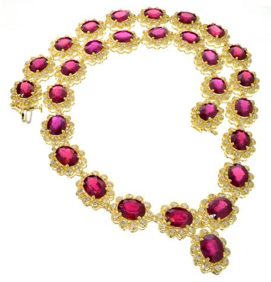 14K gold necklace with 74.44 carats of rubies and 5.89 carats of diamonds. Valued at $21,000-$41,000. Government Auction image.