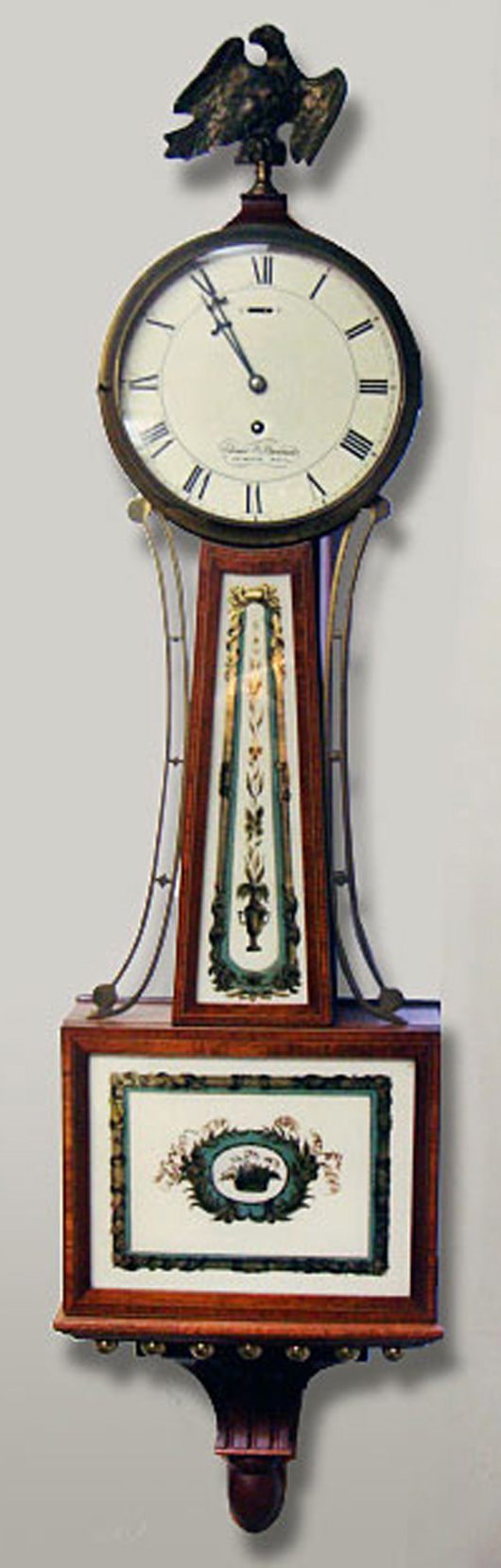 Antique clocks included this circa-1856 Elmer Stennis banjo clock with original glasses, $2,012. Image courtesy Tim's, Inc.