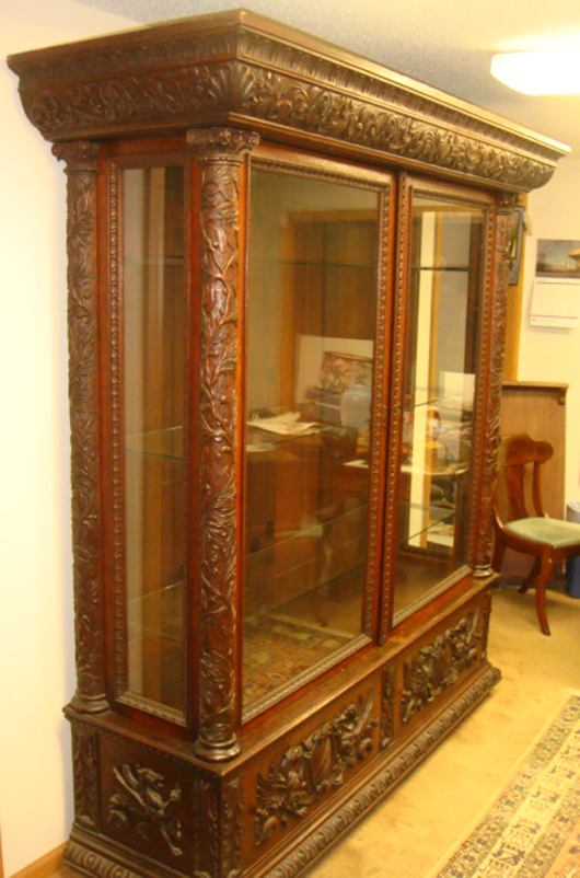 This monumental oak carved two-door glass collector's cabinet was a hit for $5,310. Image courtesy Tim's, Inc.   