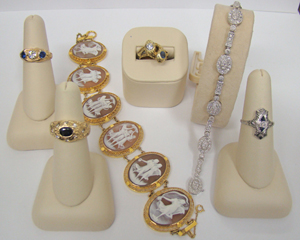 A selection of fine jewelry including rings, a cameo and gold bracelet, and a diamond Art Deco-style link bracelet. Image courtesy of Shelley's.