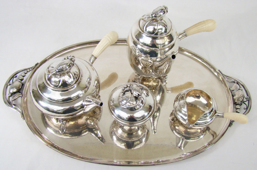 Georg Jensen sterling silver tea and coffee service, ivory handles, 'Blossom' pattern, designed by Jensen in 1905. Image courtesy of Shelley's.