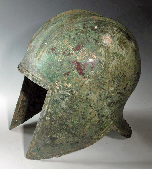 Greek Bronze Helmet of Illyrian Type, Archaic Period, ca. 600 to 550 B.C.  Estimate $20,000 - $25,000. Image courtesy of Antiquities-Saleroom.com.
