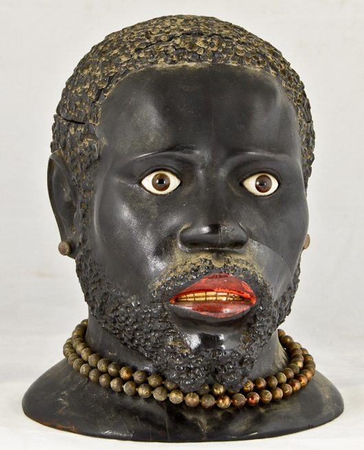    Carved and ebonized blackamoor humidor with ivory teeth and shell eyes. Sold for $3,540 Image courtesy Nest Egg Auctions.