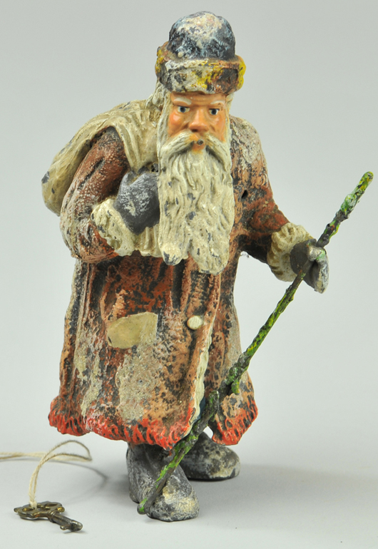 Hand-painted spelter Santa Claus still bank, German, $8,625. Bertoia Auctions image.