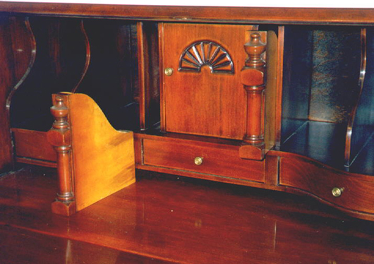 The ‘document drawers’ in this Colonial Revival desk are no longer secret.