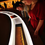 Visitors explore the Dead Sea Scrolls exhibit. Photo credit: Darryl Moran/The Franklin Institute.