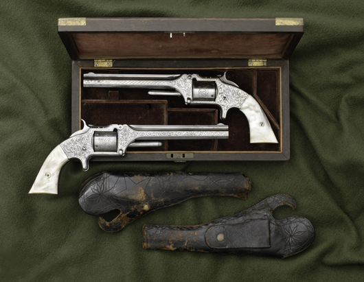 A pair of Nimschke-style engraved Smith & Wesson Model No. 2 revolvers inscribed to D.B. Dyer sold for $28,750. Image courtesy Cowan's Auctions Inc.