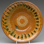 Slip-decorated, lead-glazed earthenware bowl, attributed to New Market, Va., circa 1815-1830. From the shop of Christian and Jacob Adam or Andrew and John Coffman.