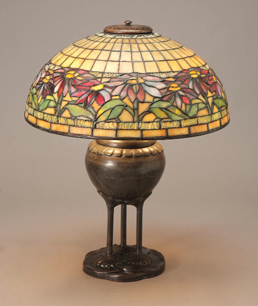 Tiffany Studios Poinsettia Favrile glass and bronze table lamp, 1899-1928. Estimate: $30,000-$40,000. Image courtesy Michaan's Auctions.