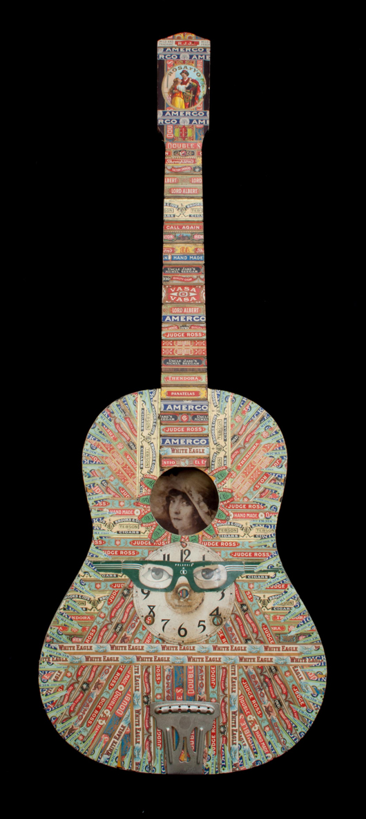 Competition was brisk for the works of Felipe Jesus Consalvos. This guitar ornamented with mixed media collage brought $6,000, at the high end of its estimate. Material Culture image.