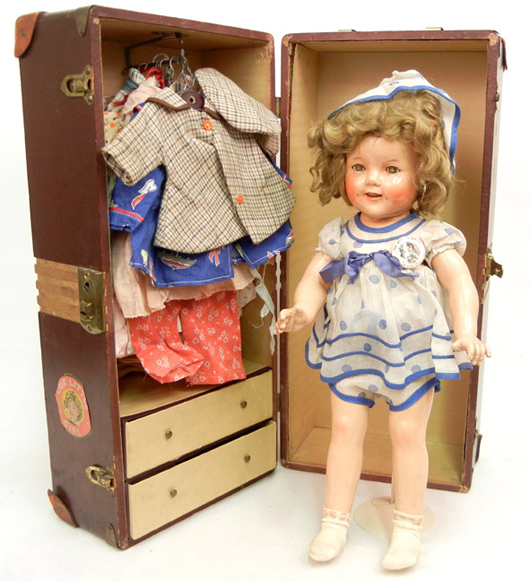 Shirley Temple doll with wardrobe and trunk. Stephenson's Auctioneers image.