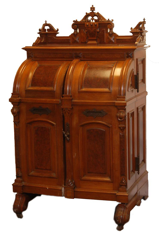 A personal office built into a desk, this late 19th century standard grade Wooton model of burled walnut carries a $10,000-$15,000 estimate. Image courtesy Elite Decorative Arts.